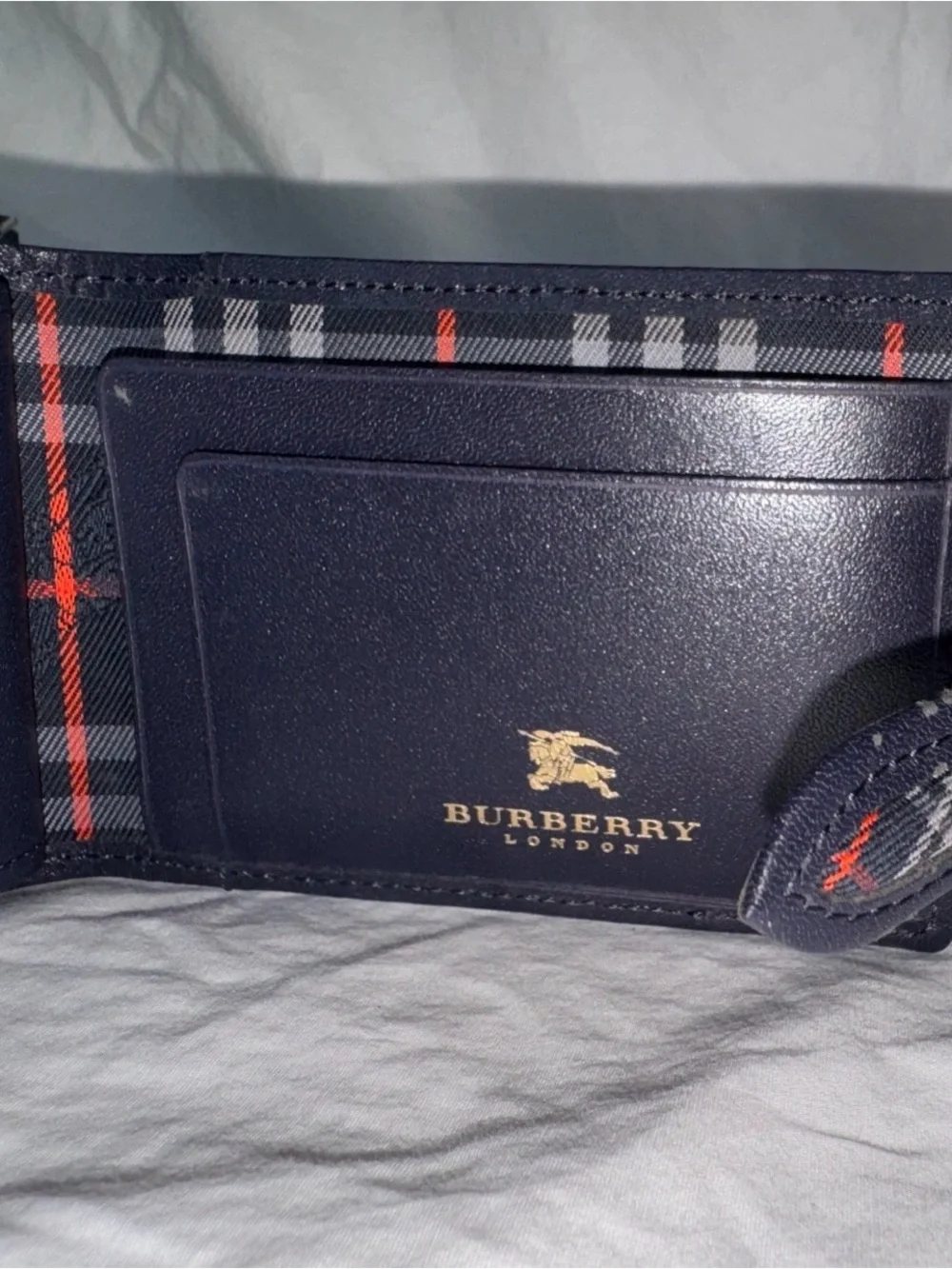 Burberry’s Black Leather Men's Wallet with Plaid Interior